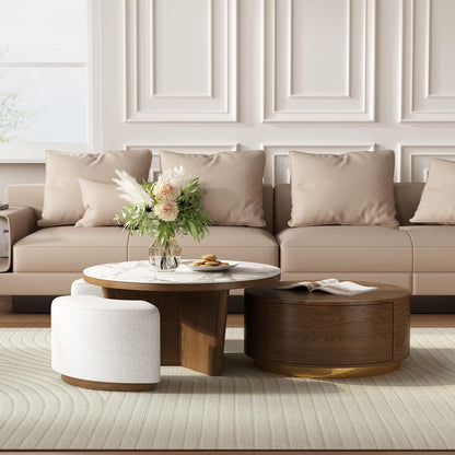 Modern beige sofa with plush cushions, round marble coffee table, and floral centerpiece