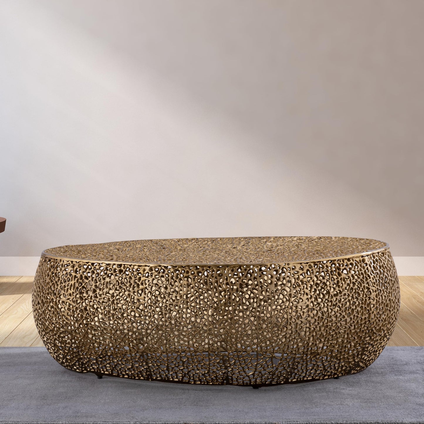50" Gold Aluminum Oval Coffee Table with Open Mesh Design